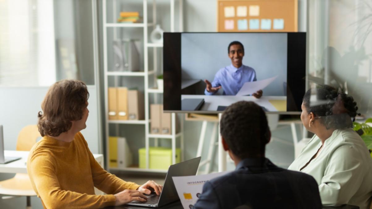 Business owner reviewing a scaling plan with an instructor during a live online session